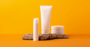 Stylized product shoot with skincare bottles on a yellow background, used to represent high-quality commercial visuals.